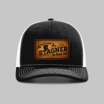 Stagner Brands Richardson 112 leather patch trucker hat black white front view dark background product photo